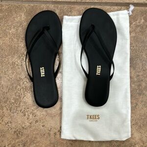 Teeks black flip flops. Size 7. Perfect condition.